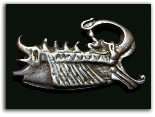 Image of brooch in shape of a ship.